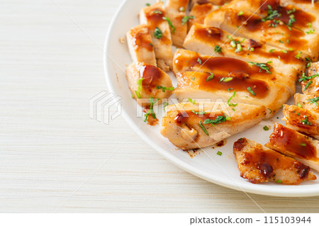 grilled chicken breast sliced on plate 115103944