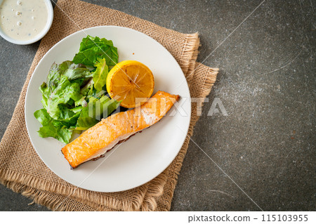 fried salmon steak with lemon and vegetable fried salmon steak with lemon and vegetable 115103955