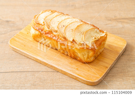 apple loaf crumbled on wood board 115104009