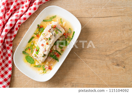 steamed sea bass fish with herbs 115104092