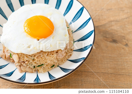 fried rice with pork and fried egg in Japanese style fried rice with pork and fried egg in Japanese style 115104110