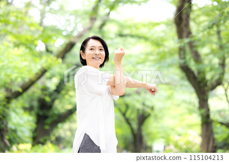 Middle-aged woman stretching Middle-aged woman stretching 115104213