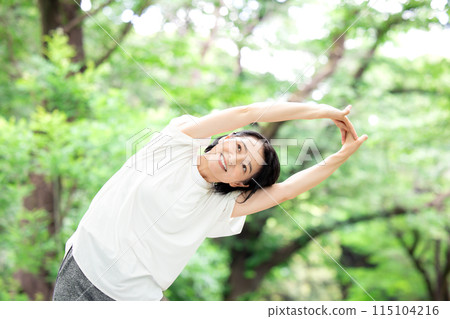 Middle-aged woman stretching 115104216