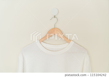 t-shirt hanging with wood hanger 115104242