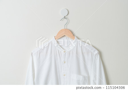 hanging shirt with wood hanger on wall hanging shirt with wood hanger on wall 115104306