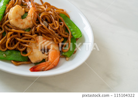 stir-fried yakisoba noodles with green peas and shrimps stir-fried yakisoba noodles with green peas and shrimps 115104322