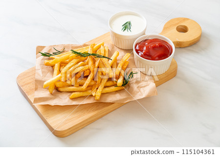 French fries with sour cream and ketchup 115104361