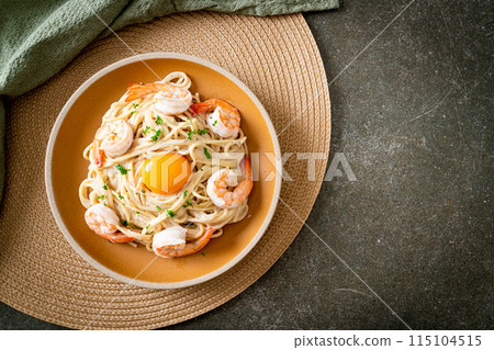 spaghetti white cream sauce with shrimps and egg yolk spaghetti white cream sauce with shrimps and egg yolk 115104515