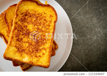 french toast on white plate 115104697