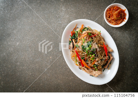 japchae or stir-fried Korean vermicelli noodles with vegetables and pork topped with white sesame japchae or stir-fried Korean vermicelli noodles with vegetables and pork topped with white sesame 115104756