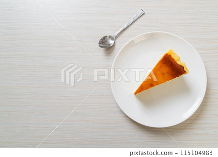 burn cheesecake on white plate burn cheesecake on white plate 115104983