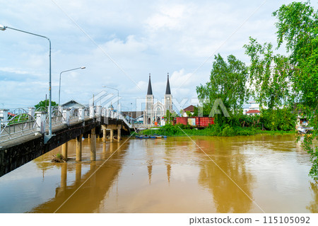 Cathedral of the Immaculate Conception with Niramon bridge at Chanthaburi in Thailand Cathedral of the Immaculate Conception with Niramon bridge at Chanthaburi in Thailand 115105092