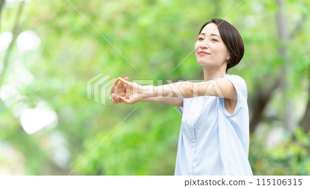 Woman stretching deep breathing exercise fresh green 115106315
