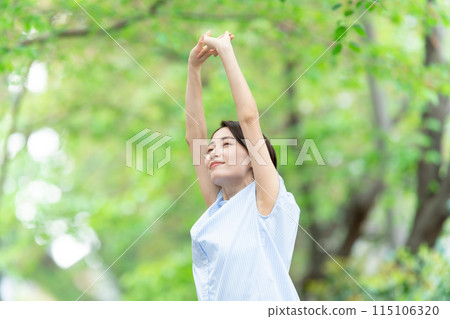Woman stretching deep breathing exercise fresh green Woman stretching deep breathing exercise fresh green 115106320