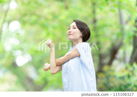 Woman stretching deep breathing exercise fresh green 115106327