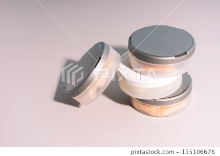 Plastic jars with bags of non-smoking tobacco product under hard light 115106678