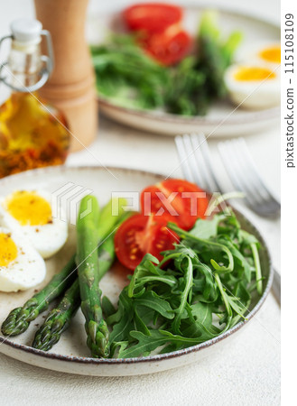 Fresh Spring Salad With Boiled Eggs, Asparagus, and Tomatoes on a Bright Day Fresh Spring Salad With Boiled Eggs, Asparagus, and Tomatoes on a Bright Day 115108109