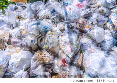 Yokohama cityscape in Japan. Garbage bags (burnable garbage) pile up at the garbage dump (garbage collection area)... = Yokohama city Yokohama cityscape in Japan. Garbage bags (burnable garbage) pile up at the garbage dump (garbage collection area)... = Yokohama city 115108985