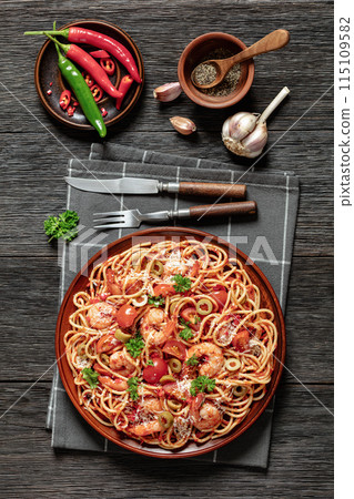 shrimp fra diavolo with spaghetti on a plate shrimp fra diavolo with spaghetti on a plate 115109582
