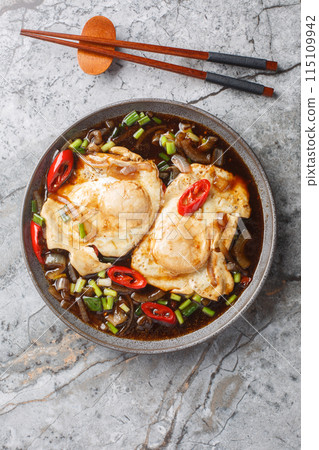 Malaysian simple food soy sauce eggs telur masak kicap closeup on the plate on the table. Vertical top view 115109942