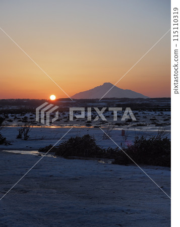 View of the sun setting over Mount Rishiri from Sarobetsu Primeval Flower Garden in winter 115110319