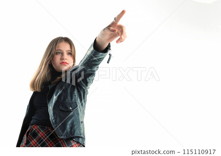 Portrait of a girl pointing her finger. Teenage girl pointing 115110917