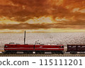 A freight train running along the sea in the evening 115111201