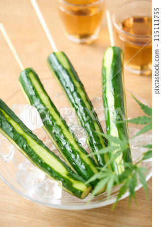 Pickled cucumber served on a glass plate 115111755