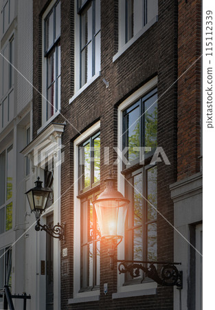 Vertical low angle shot of an old-fashioned traditional street lamp Vertical low angle shot of an old-fashioned traditional street lamp 115112339