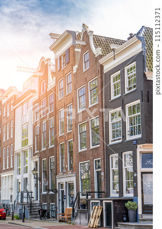 Traditional old buildings in Amsterdam, the Netherlands Traditional old buildings in Amsterdam, the Netherlands 115112371