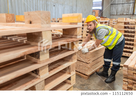Man wearing safety uniform and yellow hard hat working checking quality wooden  115112650