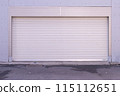 A closeup shot of automatic metal roller door used in factory, storage, garage, and industrial warehouse. The corrugated and foldable metal sheet offer space saving and provide urban and rustic feel 115112651