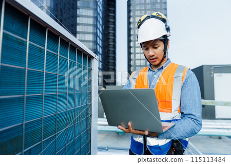 Team engineer holding tablet working at rooftop building construction. 115113484