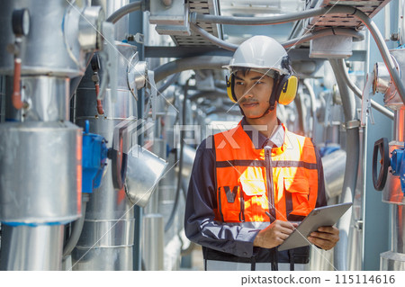 Male operator worker using tablet checking write record quality cooling air piping HVAC system Male operator worker using tablet checking write record quality cooling air piping HVAC system 115114616