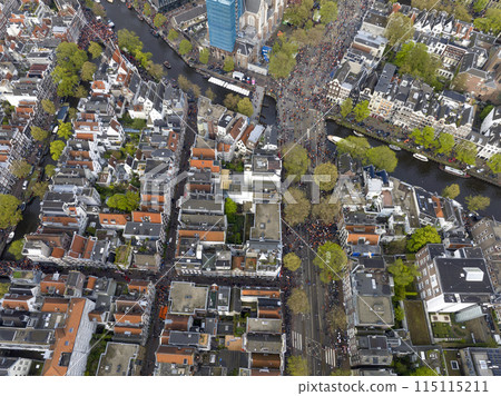 Kings Day 2024 in Amsterdam. Koningsdag, Koeningsdag in Capital of the Netherlands, Aerial Drone Fly Over Orange Suits. 115115211
