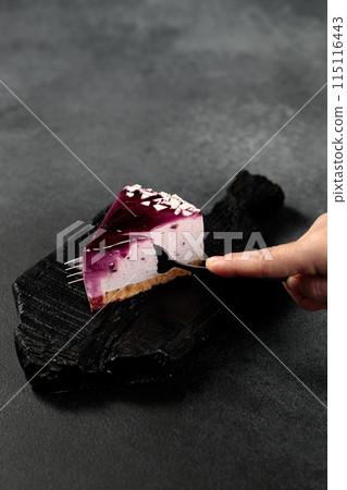 Blueberry cheesecake. On a black background 115116443