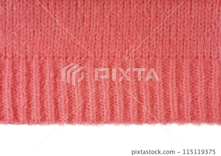 Red knitted woolen jersey fabric, sweater texture with edge isolated on white background Red knitted woolen jersey fabric, sweater texture with edge isolated on white background 115119375