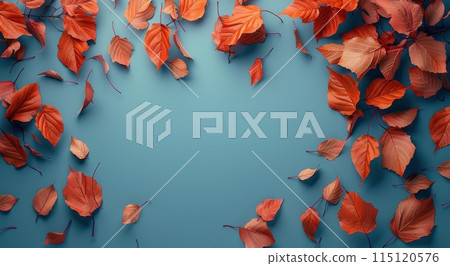 Red Autumn Leaves Scattered on a Blue Background 115120576