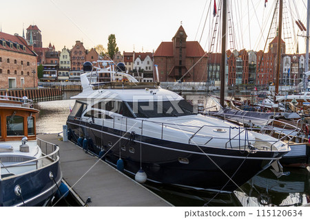 Luxury super yacht moored in Gdansk old city. Motor yacht. Beautiful view of Gdansk, Poland. 115120634