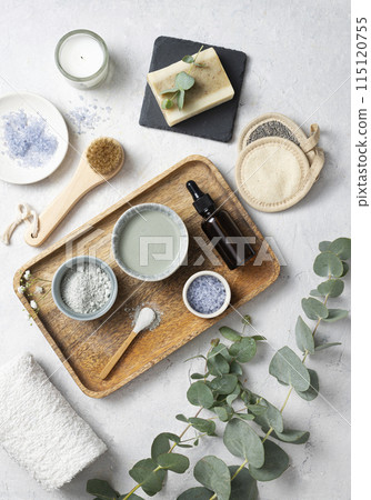 the concept of organic cosmetics with clay, sea salt, soap, brush and eucalyptus branch the concept of organic cosmetics with clay, sea salt, soap, brush and eucalyptus branch 115120755