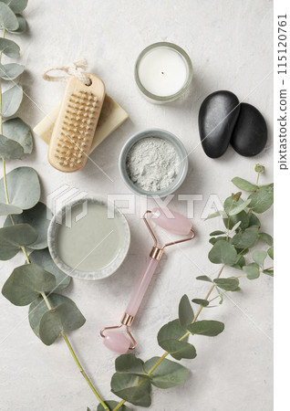Organic cosmetic green clay,  brush, massage stone  and eucalyptus branch  115120761