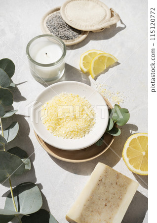 Organic yellow sea salt with lemon, soap, sponge and eucalyptus branch  115120772
