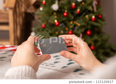 Christmas shopping with credit card. Woman holding online payment gift card. Holiday business pay Christmas shopping with credit card. Woman holding online payment gift card. Holiday business pay 115120917