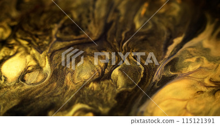 Liquid glitter. Shimmering paint flow. Defocused black yellow golden color shiny metallic sand particles acrylic mix pigment ink fluid spill abstract art background. 115121391