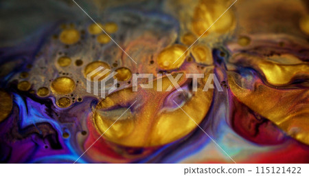 Glitter oil bubbles. Acrylic paint blend. Defocused golden yellow purple red color shiny metallic particles ink fluid pigment liquid with gloss gel drops abstract art background. 115121422