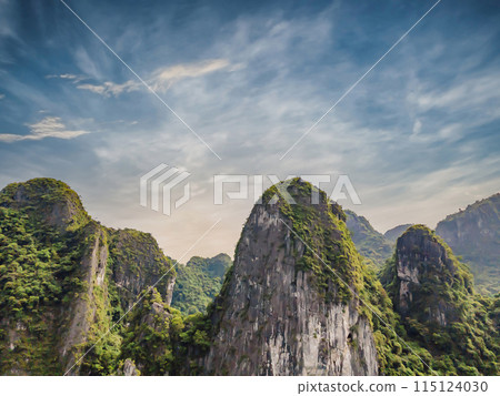 Aerial view panorama of floating fishing village and rock island, Halong Bay, Vietnam, Southeast Asia. UNESCO World Heritage Site. Junk boat cruise to Ha Long Bay. Popular landmark of Vietnam Aerial view panorama of floating fishing village and rock island, Halong Bay, Vietnam, Southeast Asia. UNESCO World Heritage Site. Junk boat cruise to Ha Long Bay. Popular landmark of Vietnam 115124030