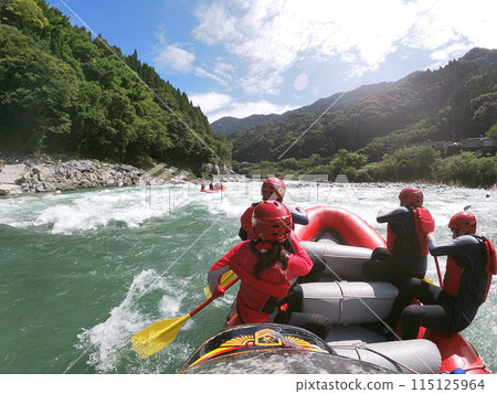 Enjoy rafting on a sunny day Enjoy rafting on a sunny day 115125964
