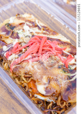 Delicious Hiroshima-style okonomiyaki from a food stall Delicious Hiroshima-style okonomiyaki from a food stall 115126691