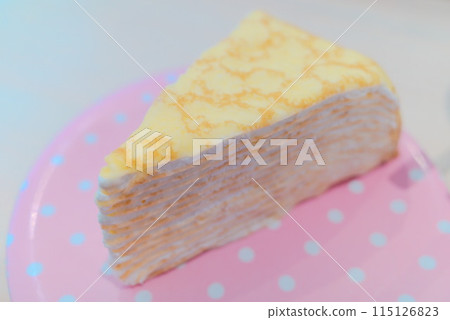 Mille crepes served on a polka dot plate Mille crepes served on a polka dot plate 115126823