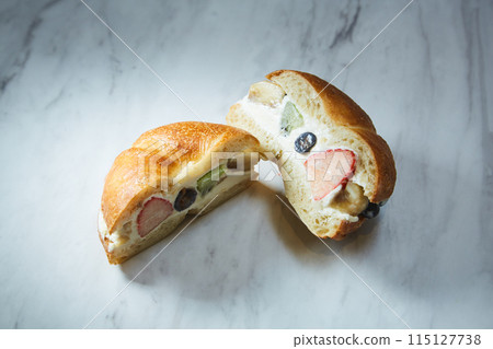 Homemade fruit sandwiches served on a marble table 115127738